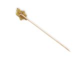 a close up of a wooden stick with a flower on it
