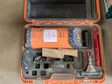 a tool in a case that is sitting on the floor
