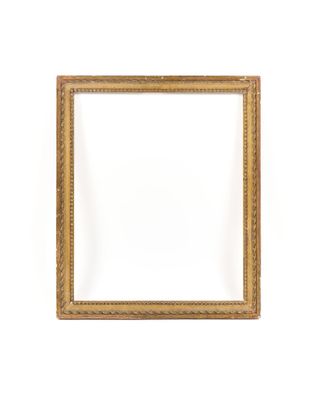 a gold frame on a white wall with a white background