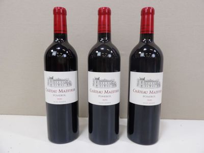three bottles of red wine are lined up on a table