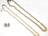necklace and earring set with pearls on a white background