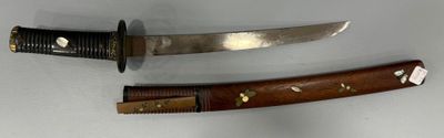 two different types of knives on a white surface