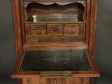 an old wooden desk with drawers and a marble top