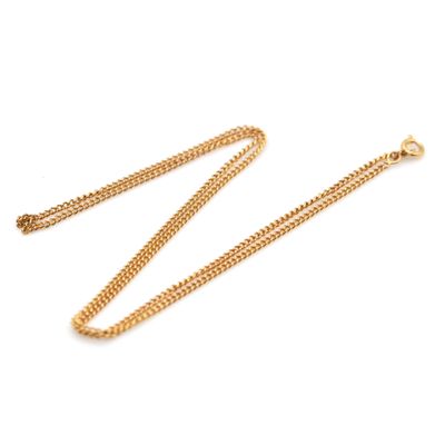 a gold chain necklace on a white background