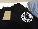 a black jacket with a blue and white logo on it