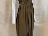 an image of a mannequin wearing a brown dress on a mannequin stand