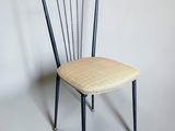 an image of a chair with a seat made out of metal