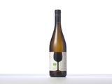 a bottle of wine sitting on top of a table next to a glass
