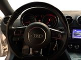 steering wheel and dashboard of a car with various gauges and gauges
