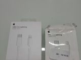 an apple iphone charger with its packaging on a table