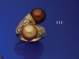 une image représentant une bague en or sertie d'une perle brune et de diamants