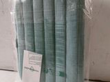 a bag of blue folded napkins sitting on a table