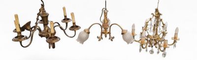 three chandeliers hanging from the ceiling of a room