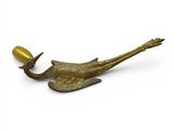 an image of a brass figurine of a bird with a hat on it ' s head