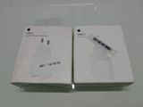two boxes of apple airpods are sitting on a table