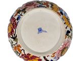 an image of a decorative plate with flowers on it