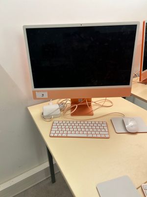 a desk with a computer, keyboard and mouse on it