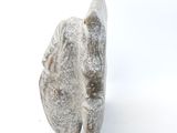 an image of a stone object on a white surface