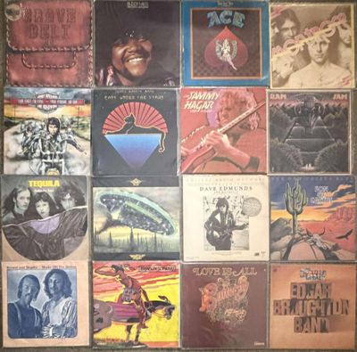 the album covers of various albums are displayed on a wall