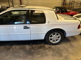 a white car that is parked in a garage
