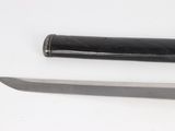 a knife and a knife holder on a white surface