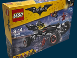 lego batman batmobile set in a box on a blue background