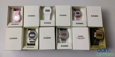 six boxes of assorted casio watches are stacked on top of each other