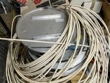 a pile of wires and boxes on the floor