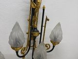 a chandelier hanging on the wall with five lights