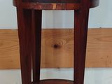 a small wooden table with a drawer on top of it