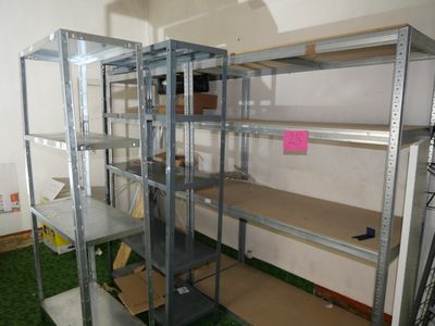 a room with a shelf and shelves in it
