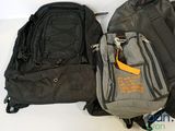 two backpacks sitting next to each other on a table
