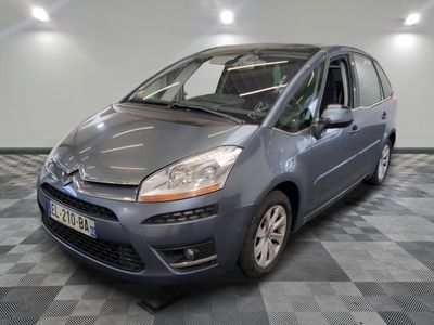 a picture of a grey citrole parked in a garage