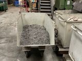 a dump truck that is filled with gravel in a warehouse