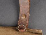 an image of a close up of a brown bag with a leather handle