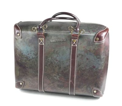 a brown leather bag with a handle on a white background