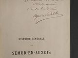 an old book with a handwritten title on it