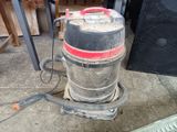 a vacuum cleaner that is sitting on the ground