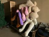 a pile of stuffed animals sitting on top of a pile of boxes