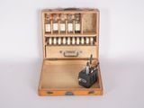 a small wooden box with bottles of liquor in it
