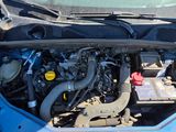 a blue car with its hood open and the engine in the trunk