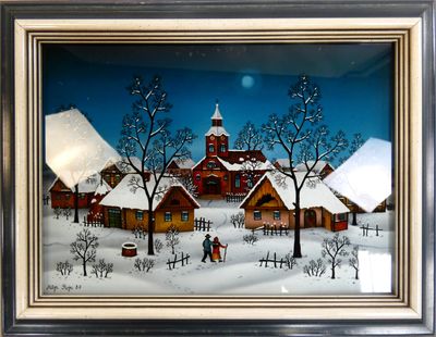 tableau encadré représentant un village enneigé avec une église en arrière-plan