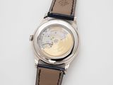 an image of a close up of a watch on a white surface