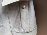 an image of a jacket hanging on a clothes rack
