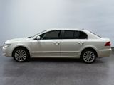 the white car is parked on the concrete floor in the room