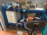 a chair that is sitting in front of a workbench