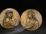 a pair of bronze plaques depicting jesus and mary