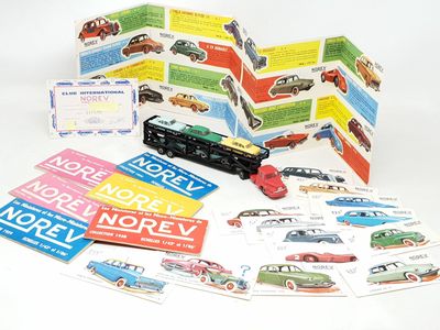 a lot of cards and a toy car on the table