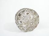 a glass object that is sitting on a white surface