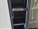 an image of a refrigerator with a glass door